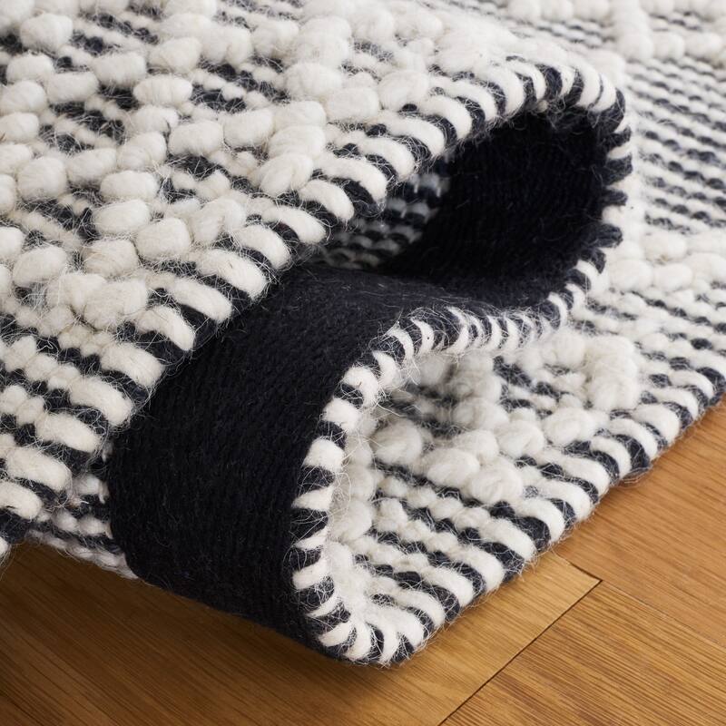 SAFAVIEH Handmade Natura Fehrat Wool Braided Tassel Rug