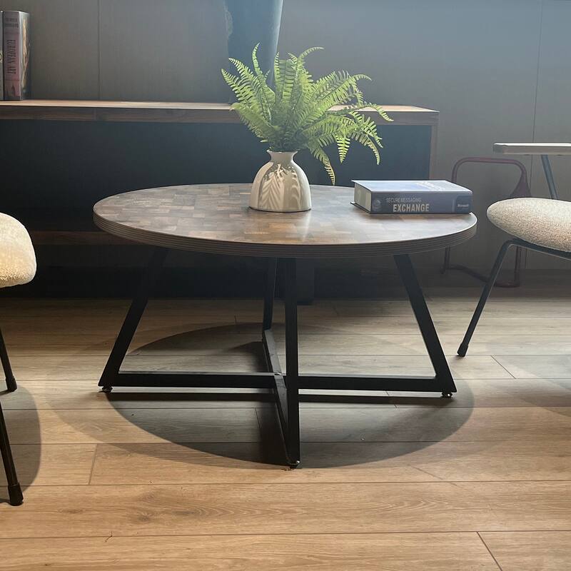 Round Coffee Table with Wood Grain and Black Metal, a Stylish and Functional Centerpiece for Your Living Space.
