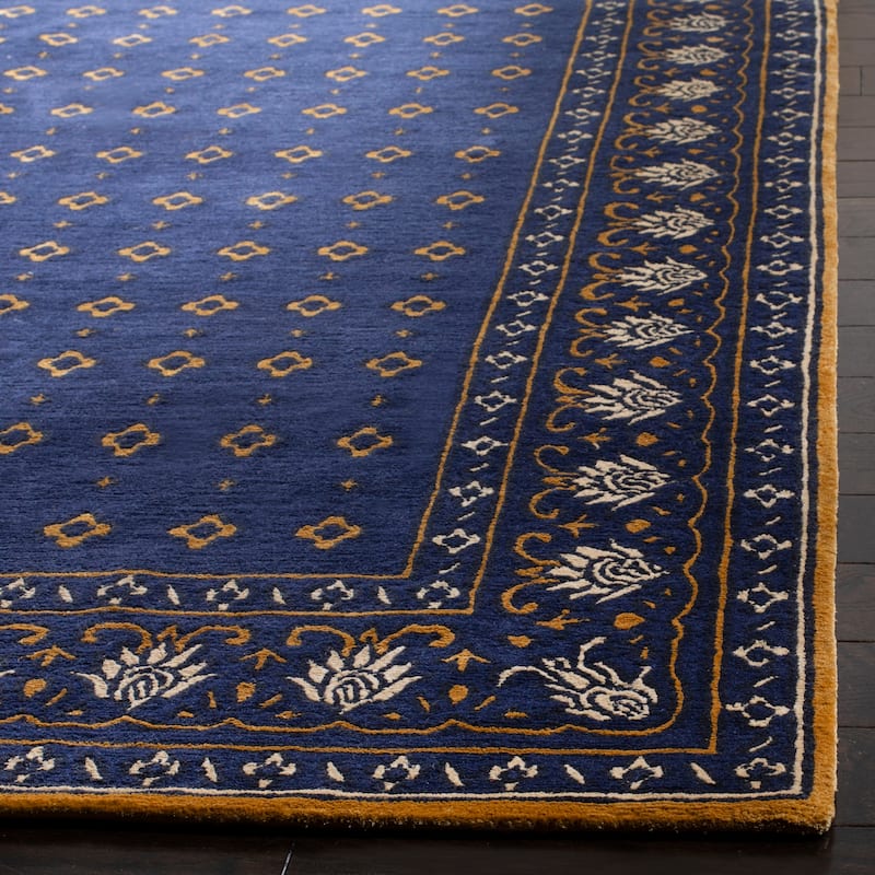 SAFAVIEH Hand-knotted Nepalese Dragomila Wool Rug