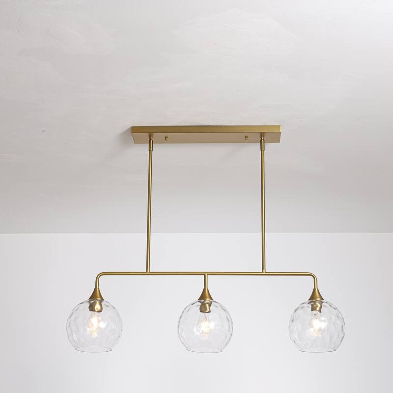 3-Light Modern Black/Brushed Gold Linear Chandelier for Kitchen Island with Clear Textured Glass Globe Shades - Clear/Gold