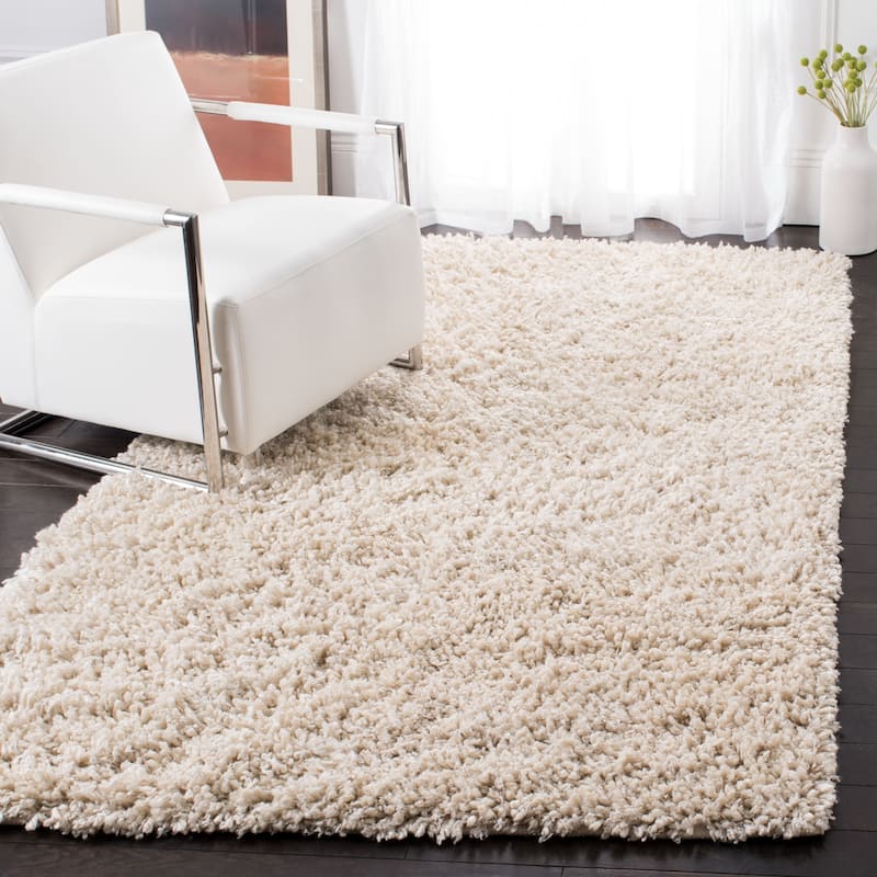 SAFAVIEH Handmade Sheep Shag Malti Solid Area Rug - 4' x 6' - Ivory