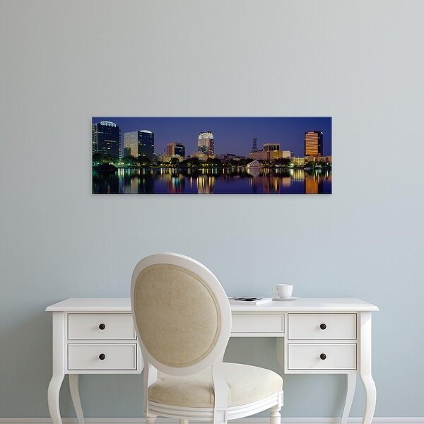 Easy Art Prints Panoramic Images's 'Reflection of buildings in water, Orlando, Florida, USA' Premium Canvas Art
