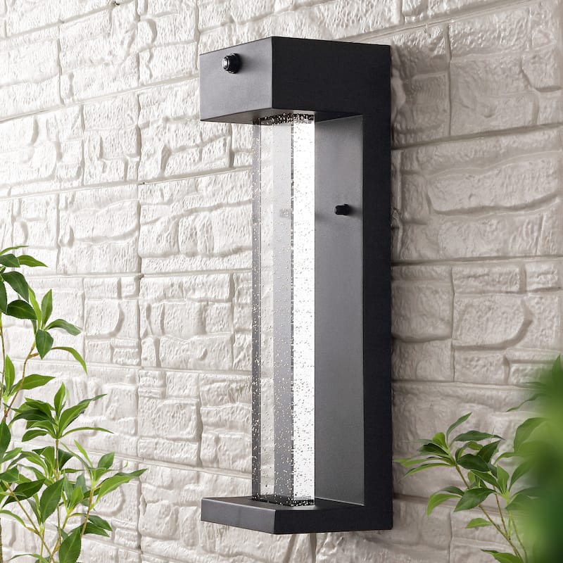 Horizone 5.13" 1-Light Modern Iron/Seeded Glass with Dusk-to-Dawn Sensor Integrated LED Outdoor Sconce, Black by JONATHAN Y
