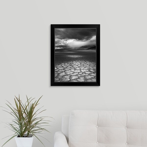 "A rainstorm travels over Steens Mountain as seen from the Alvord Desert in Oregon." Black Framed Print