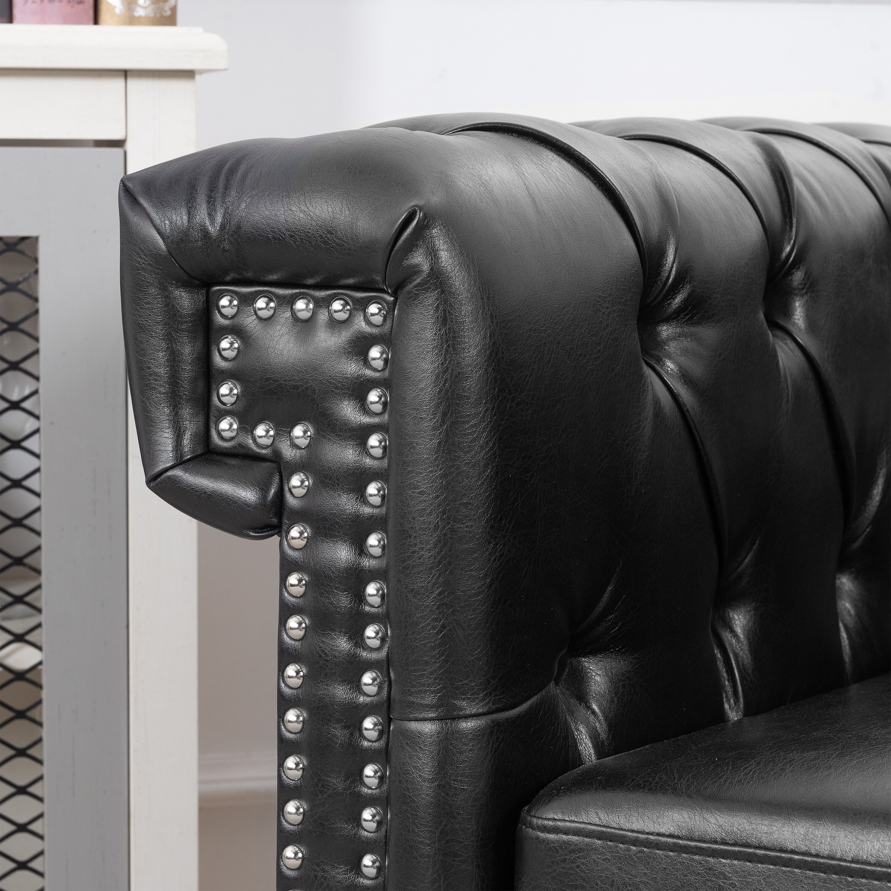 Black leather chair with online silver studs