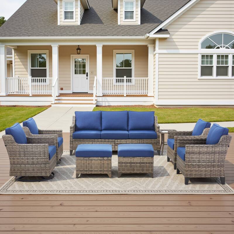 Glissia 8-Piece Gray Wicker Patio Conversation Set with Swivel Gliders and Ottomans - Navy Blue Cushions - Gray Wicker
