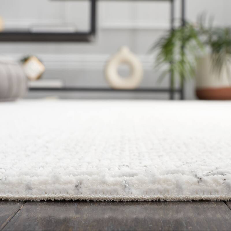 SAFAVIEH Whisper Jiang Contemporary Fringe Rug