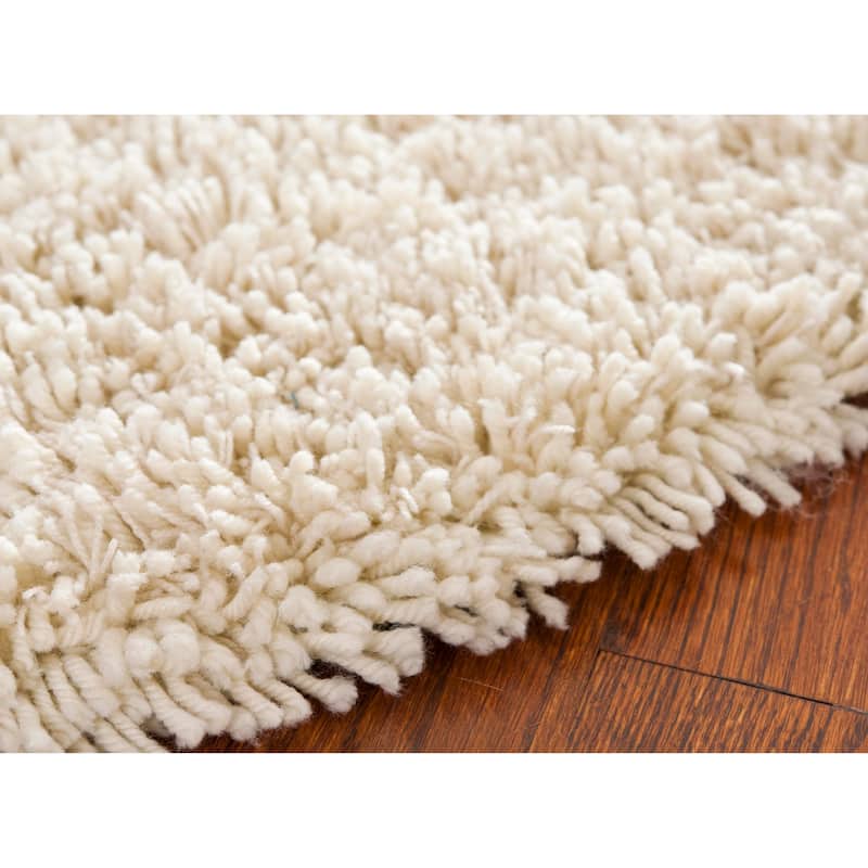 SAFAVIEH Handmade Classic Shag Nakhshun Rug
