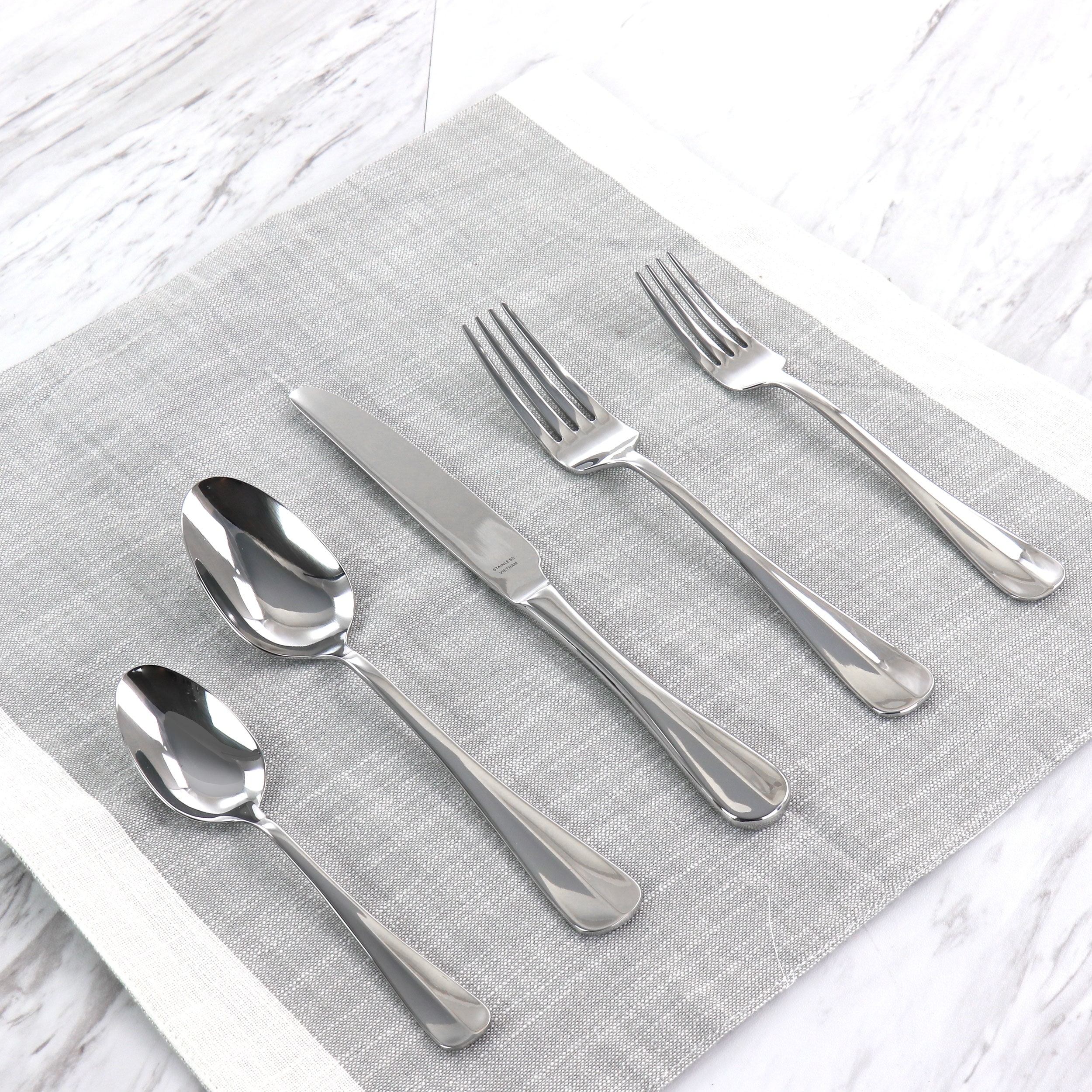 https://ak1.ostkcdn.com/images/products/is/images/direct/a6d8a5f7d826cfd4e1d91f5529be0b90aacc1a33/Martha-Stewart-Springbank-20-Piece-Stainless-Steel-Flatware-Set.jpg