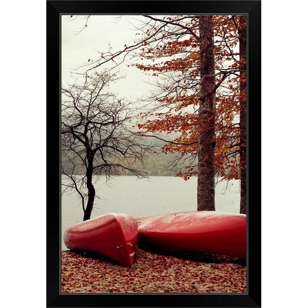 "Red canoes park fallen leaves by the lake" Black Framed Print