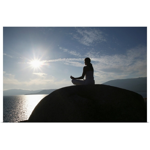 "Woman meditating on rock" Poster Print
