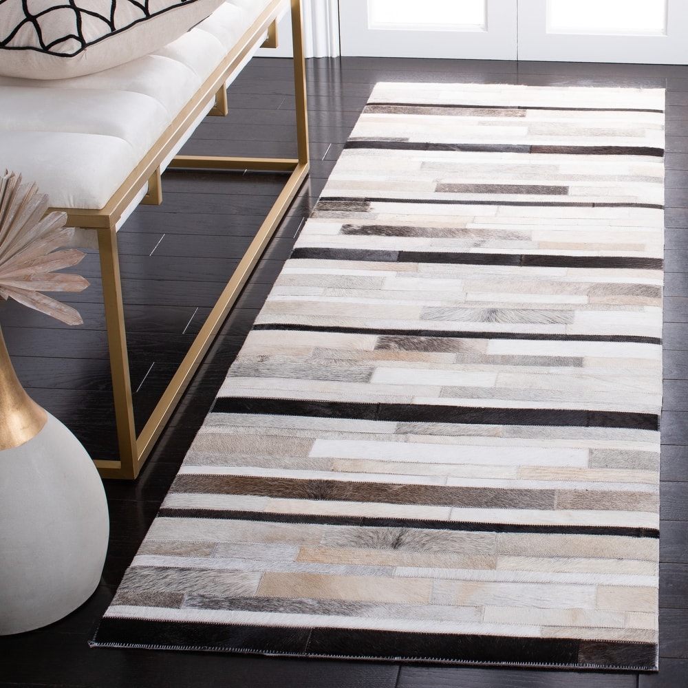 SAFAVIEH Handmade Studio Leather Syreeta Natural Hide Leather Rug