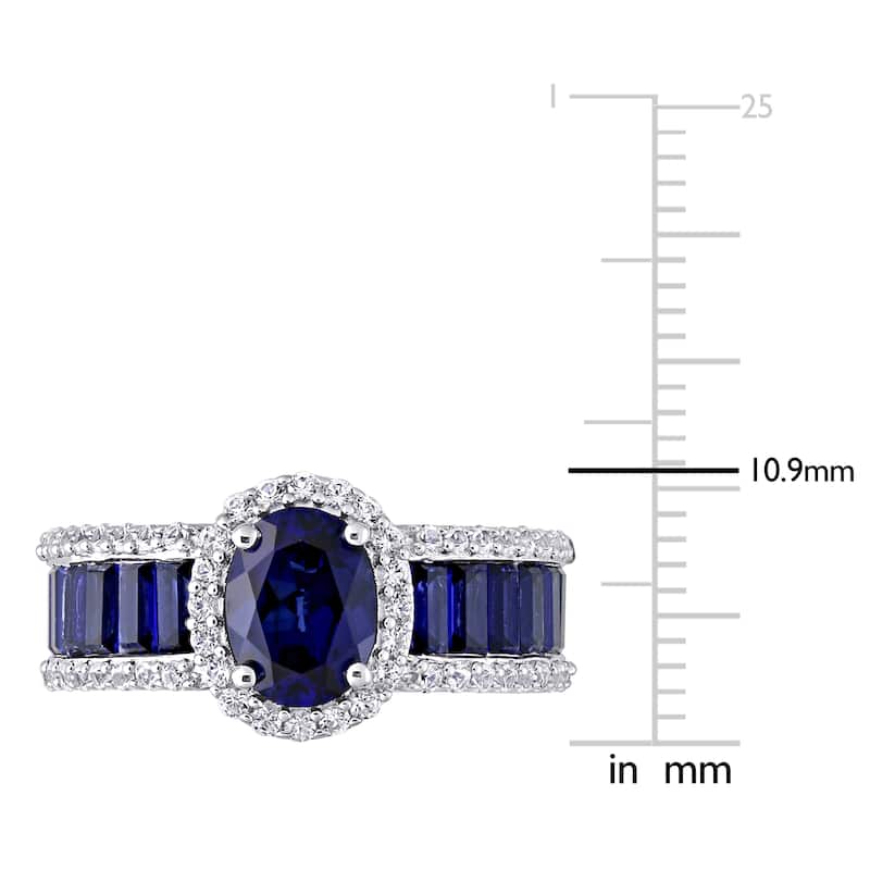 Oval & Baguette-cut Created Blue and White Sapphire Halo Engagement Ring in Sterling Silver by Miadora