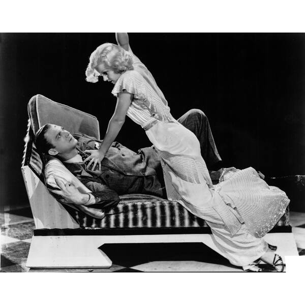 Jean Harlow Scene from a Film Knelt on the Couch in White Ruffled