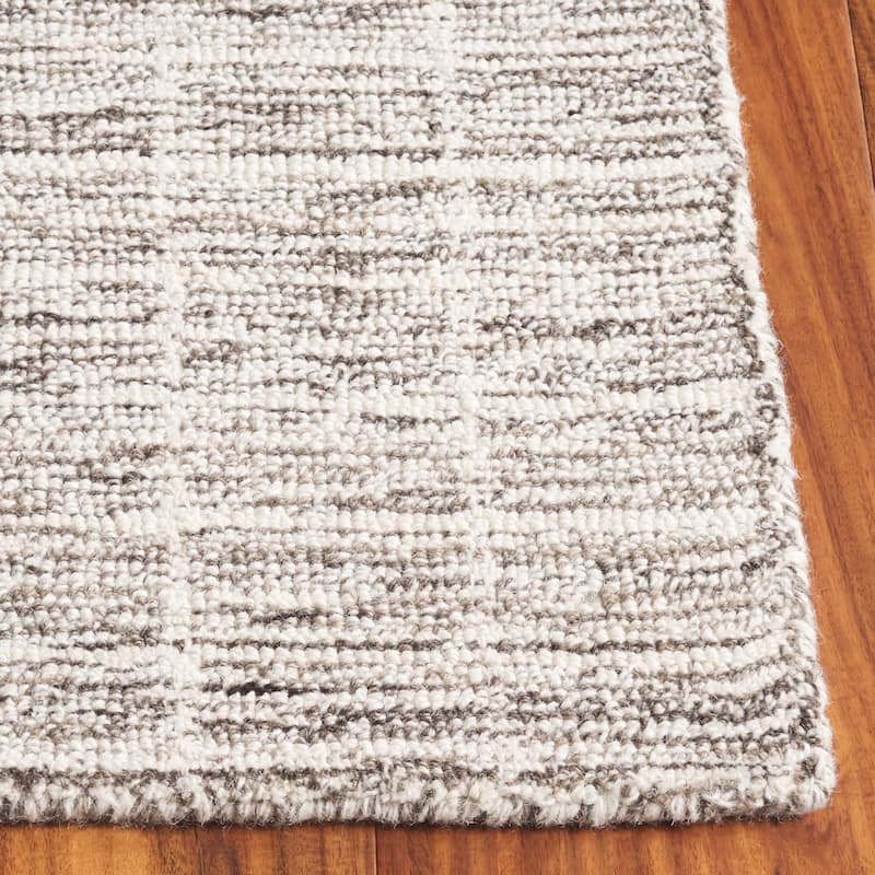 SAFAVIEH Handmade Ebony Peigi Contemporary Wool Rug