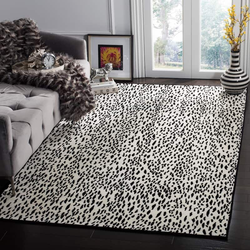 SAFAVIEH Handmade Marbella Goril Modern Polyester Rug - 4' x 6' - Ivory/Black