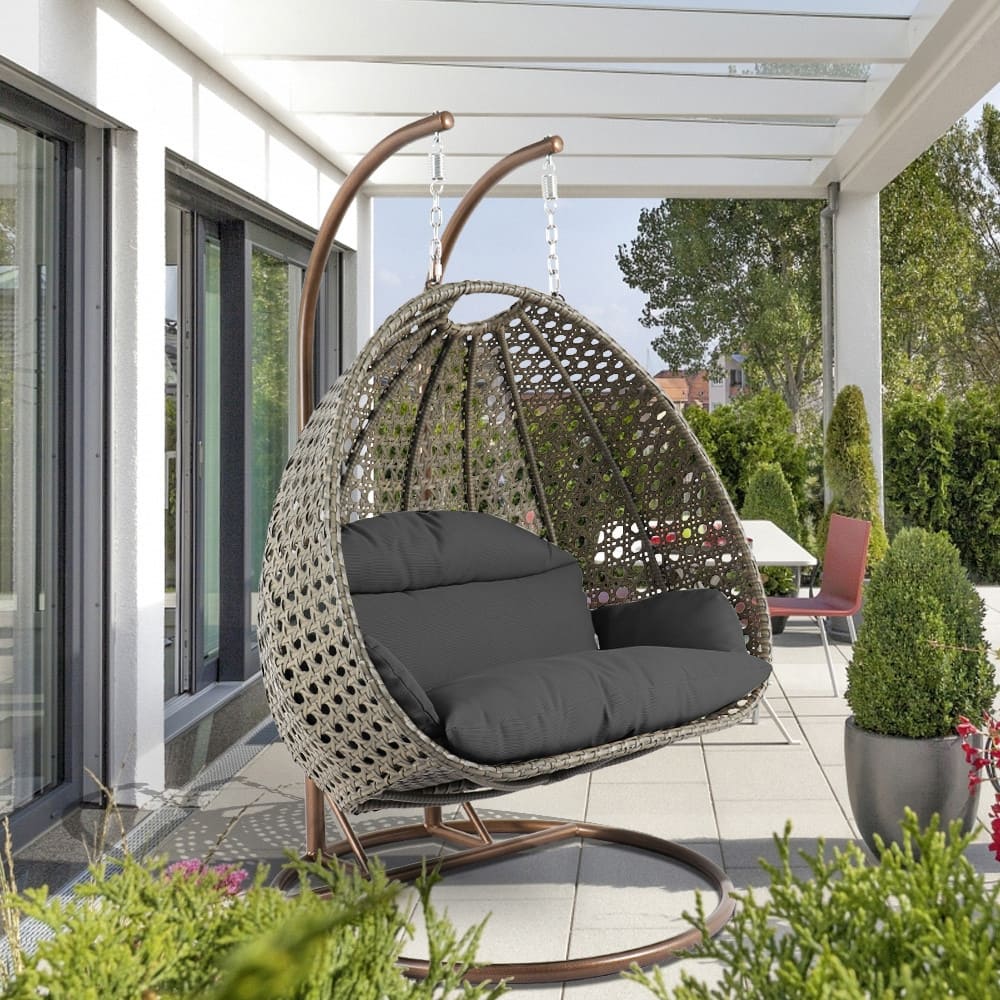 LeisureMod Modern 2-Person Egg Hanging Swing Chair with Beige Wicker, Oxford Fabric Cover, Patio Hammock Lounger and Cushions