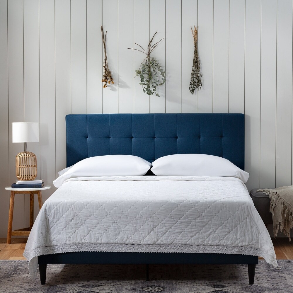 Blue tufted platform shop bed