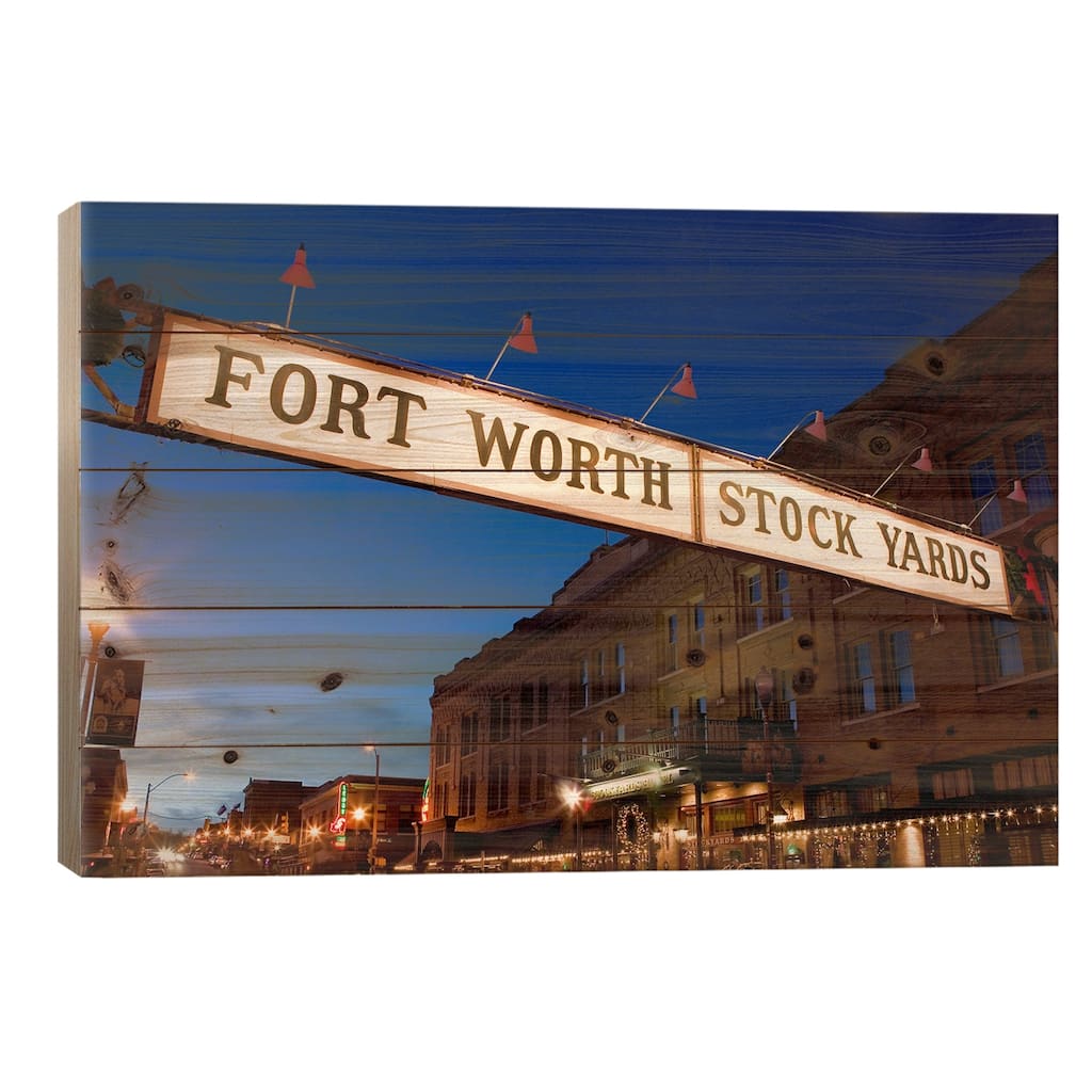 Signboard over a road at dusk, Fort Worth Stockyards, Fort Worth, Texas, USA Print On Wood by Panoramic Images - Multi-Color