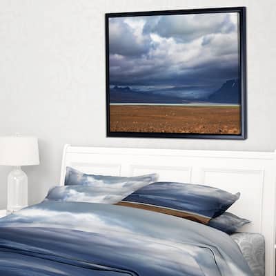 Designart "Stretch of Land under Blue Sky" Landscape Artwork Print on Framed Canvas