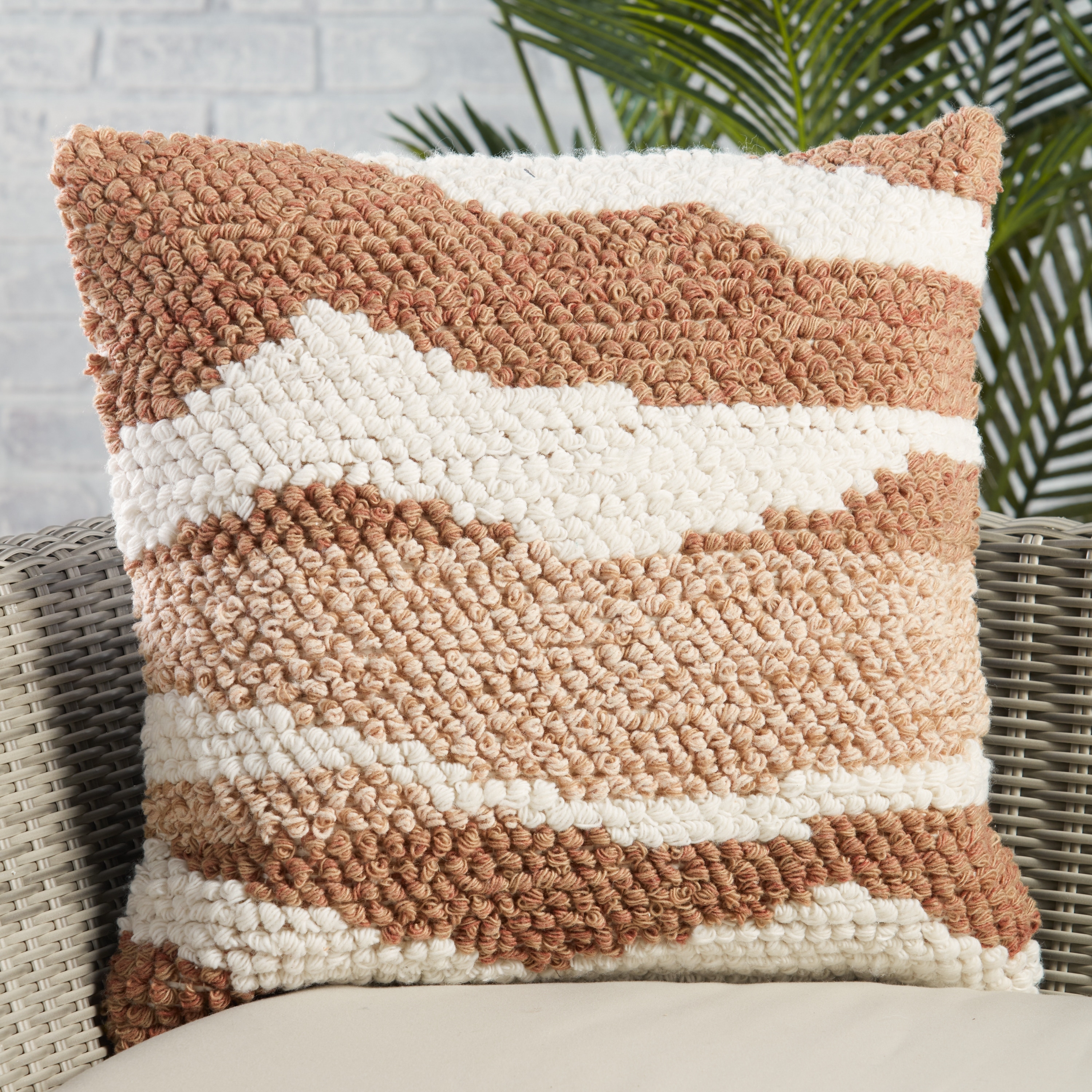 Tan and white store outdoor pillows