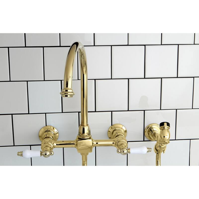 Kingston Brass Restoration Wall Mount Bridge Kitchen Faucet with Brass Sprayer