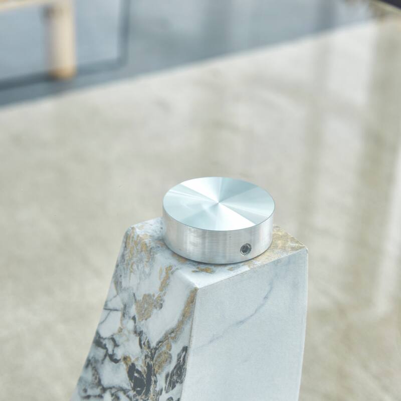 glass coffee table with marble patterned MDF legs and stainless steel decorative columns