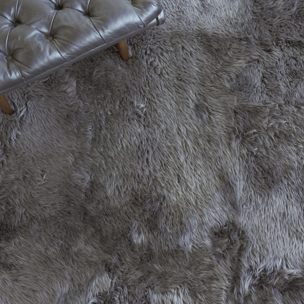 EXQUISITE RUGS Sheepskin Hand-stitched Dark Grey Area Rug.