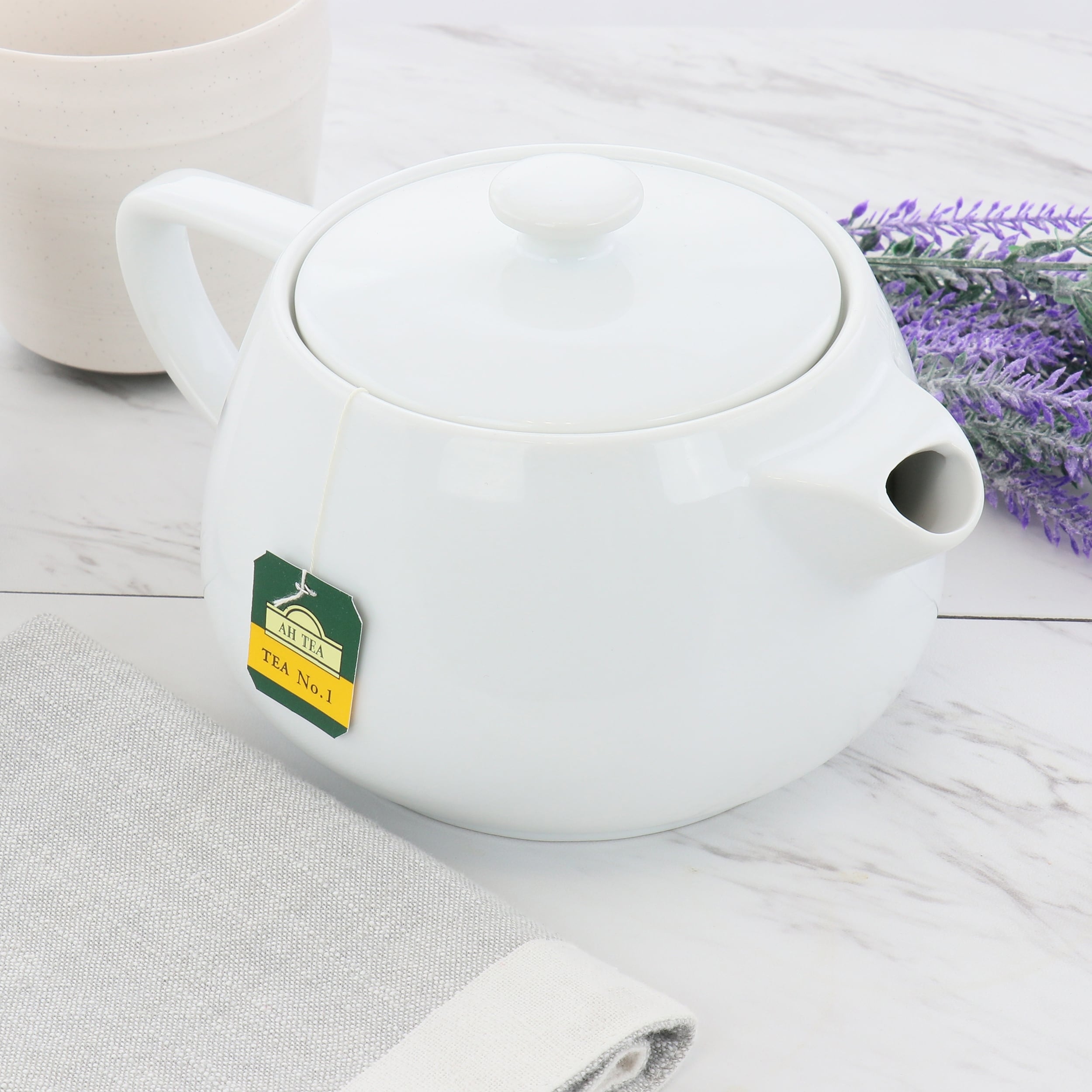 https://ak1.ostkcdn.com/images/products/is/images/direct/aa221ac209f83b0bcef15e038bc2315186547f0a/32-Ounce-Porcelain-Teapot-With-Lid-in-White.jpg