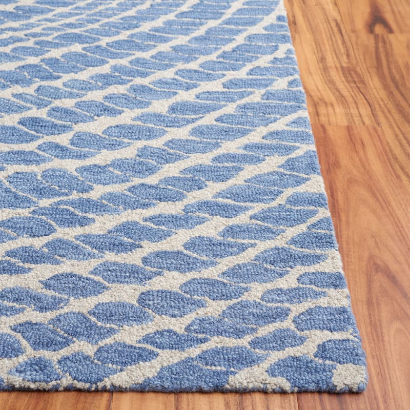 SAFAVIEH Handmade Ebony Nailja Modern Wool Rug