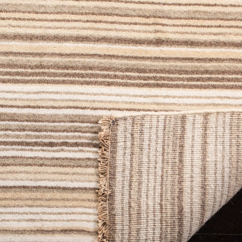 SAFAVIEH Couture Hand-knotted Tibetan Tjipkje Modern Wool Rug