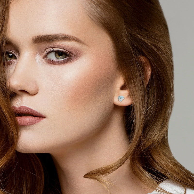 Miadora 2ct TGW Sky Blue Topaz and Diamond Accent Heart Stud Earrings Sterling Silver