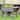 Outsunny 49'' x 21'' x 34'' Raised Garden Bed w/ 8 Grow Grids, Outdoor Wood Plant Stand w/ Storage Shelf and Lockable Wheels