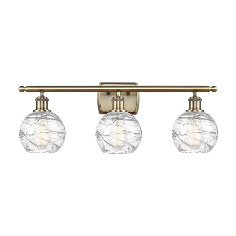 Innovations Lighting 516-3W-11-26 Athens Vanity Athens 3 Light 26" - Antique Brass / Clear Deco Swirl