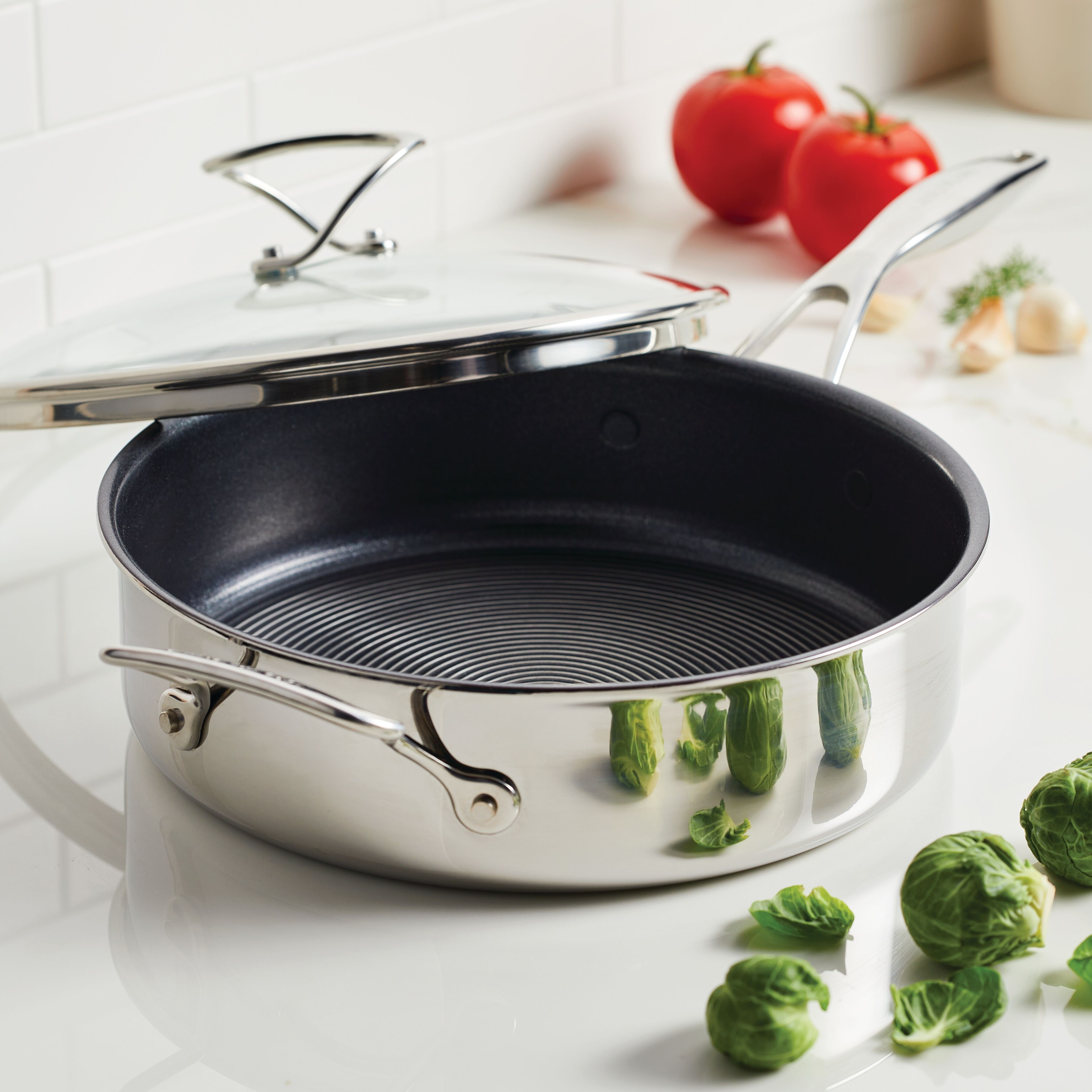 https://ak1.ostkcdn.com/images/products/is/images/direct/ab1a085ed8af9d8d0d4beb814978fa9b7aadd70e/Circulon-Clad-Stainless-Steel-Saut%C3%A9-Pan-with-Lid-and-Hybrid-SteelShield-and-Nonstick-Technology%2C-5-Quart%2C-Silver.jpg