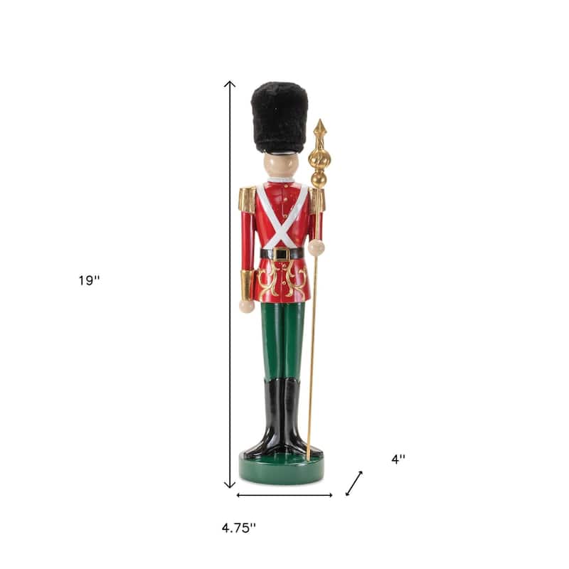 HomeRoots 19" Black Red And Green Resin Christmas Nutcracker Tabletop Sculpture - 4.75 in. x 19.00 in. x 4.00 in.