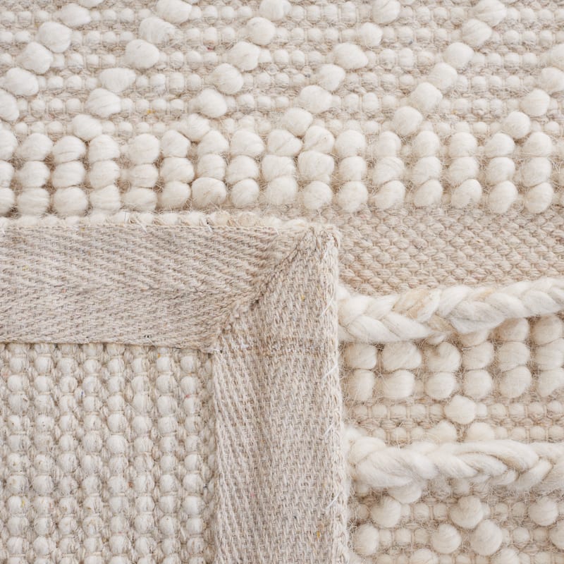SAFAVIEH Handmade Natura Mette Wool Braided Tassel Rug