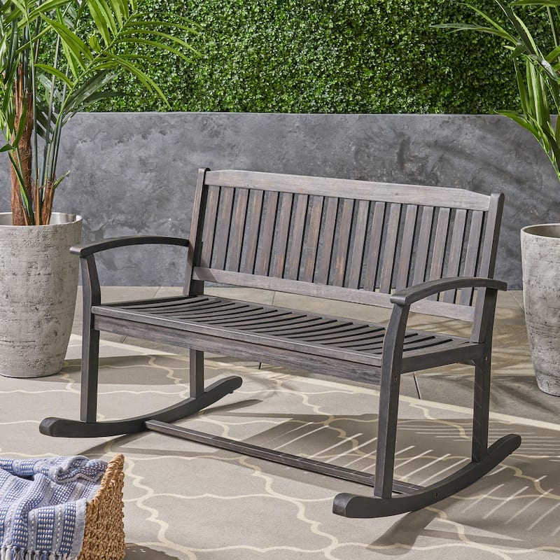 Roomfitters Outdoor Wooden Rocking Loveseat with Slatted Backrest, Wide Armrests and Classic Curved Base