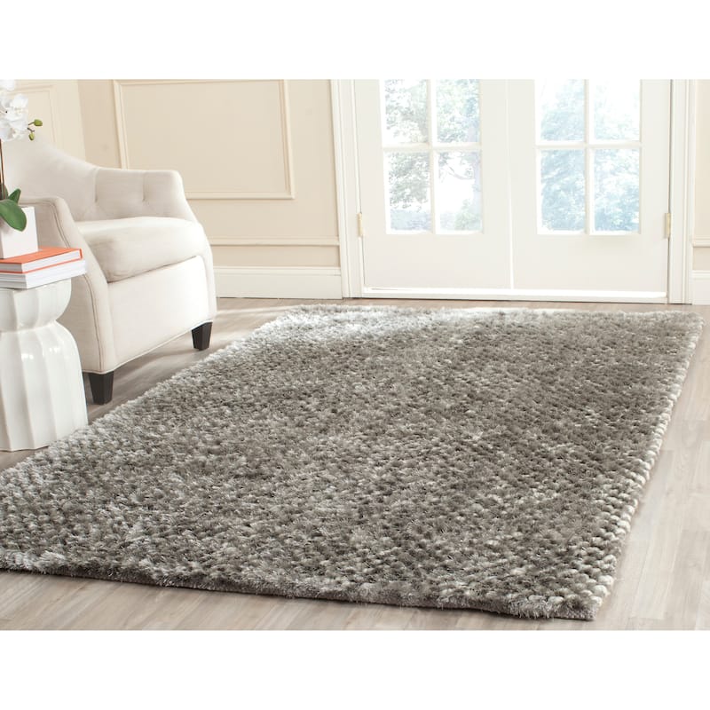 SAFAVIEH Handmade Saint Shantell Shag Yuiko Solid Polyester Rug - 6' x 9' - Silver