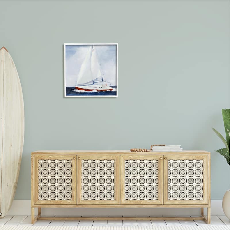 Stupell Sail Boat Against Cloudy Sky Ocean Foam Splashing Framed Wall Art - Blue