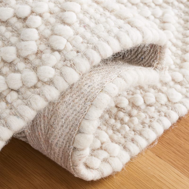 SAFAVIEH Handmade Natura Mette Wool Braided Tassel Rug