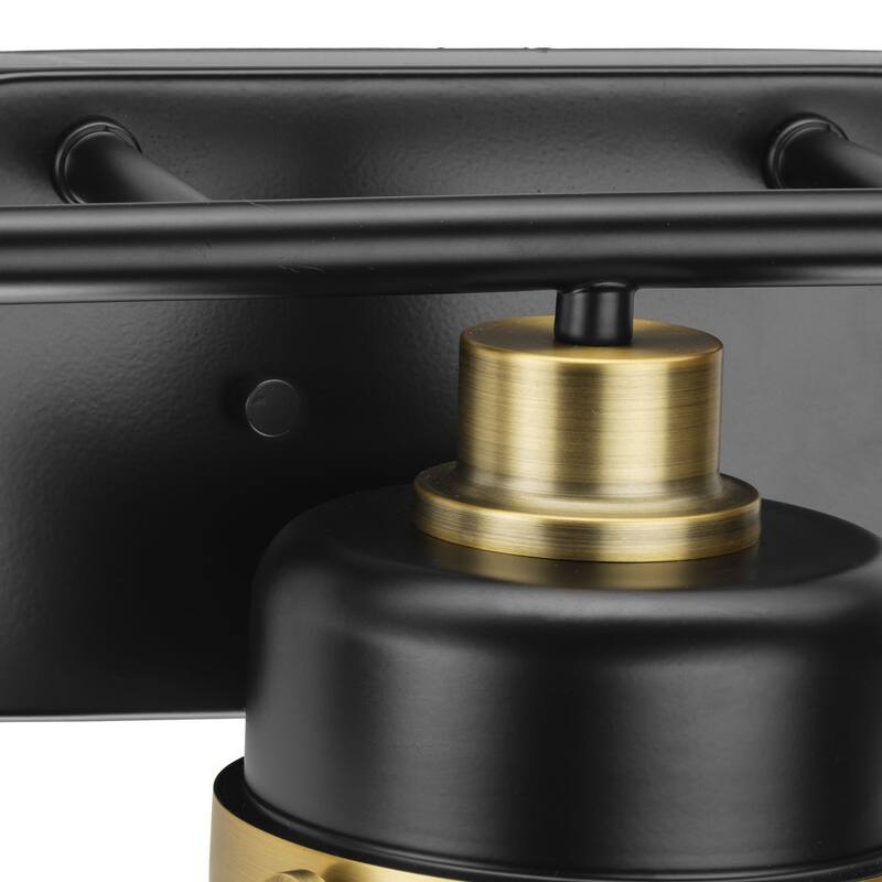 Beckner Collection Three-Light Matte Black Clear Glass Urban Industrial Bath Light with Vintage Brass Accents