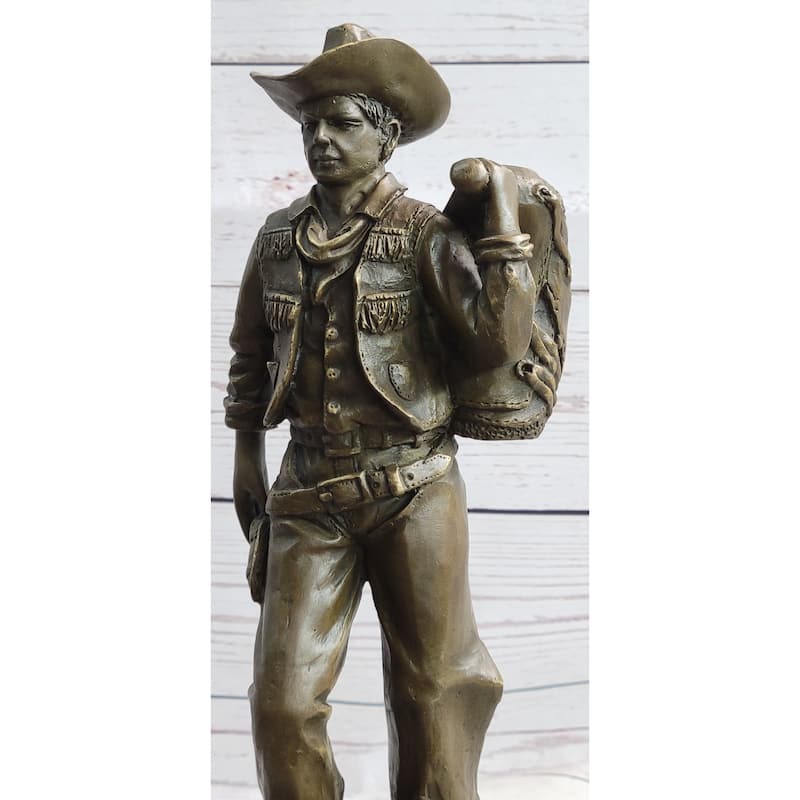 Country Western Cowboy In Chaps Carrying Imitative Horse Saddle Bronze Statue Sculpture Figure 12 Inches X 4 Inches