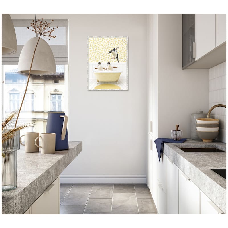 Kate and Laurel Sylvie Penguins in Cottage Yellow Bathtub Framed Canvas by Amy Peterson