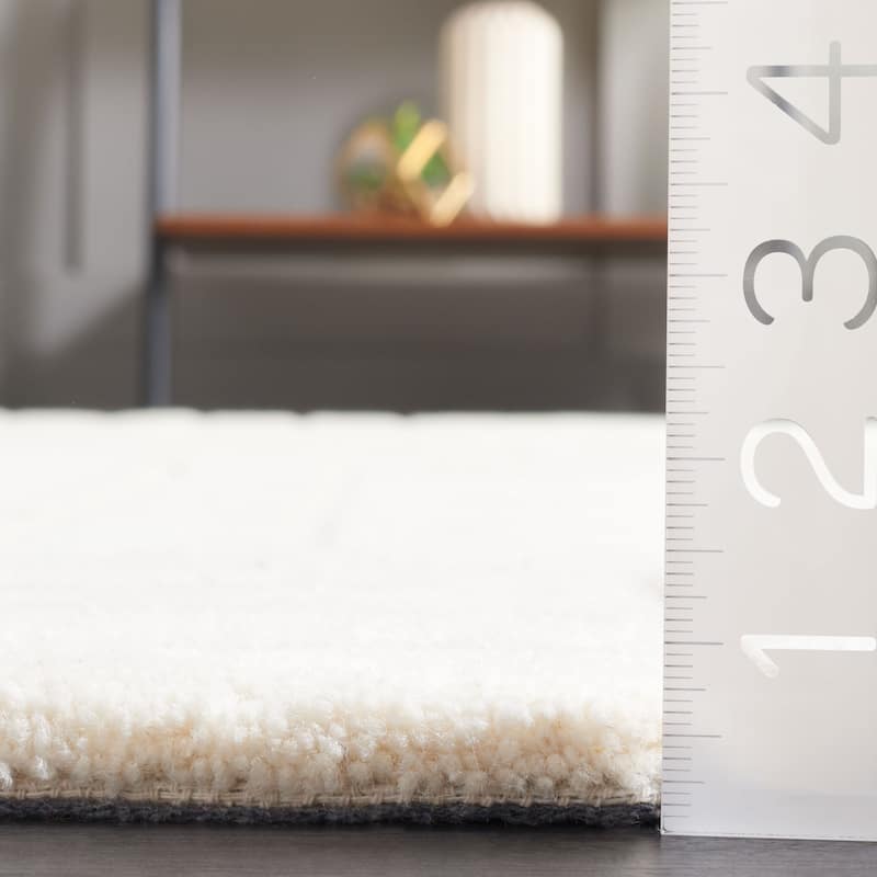 SAFAVIEH Handmade Ebony Sanela Modern Wool Rug