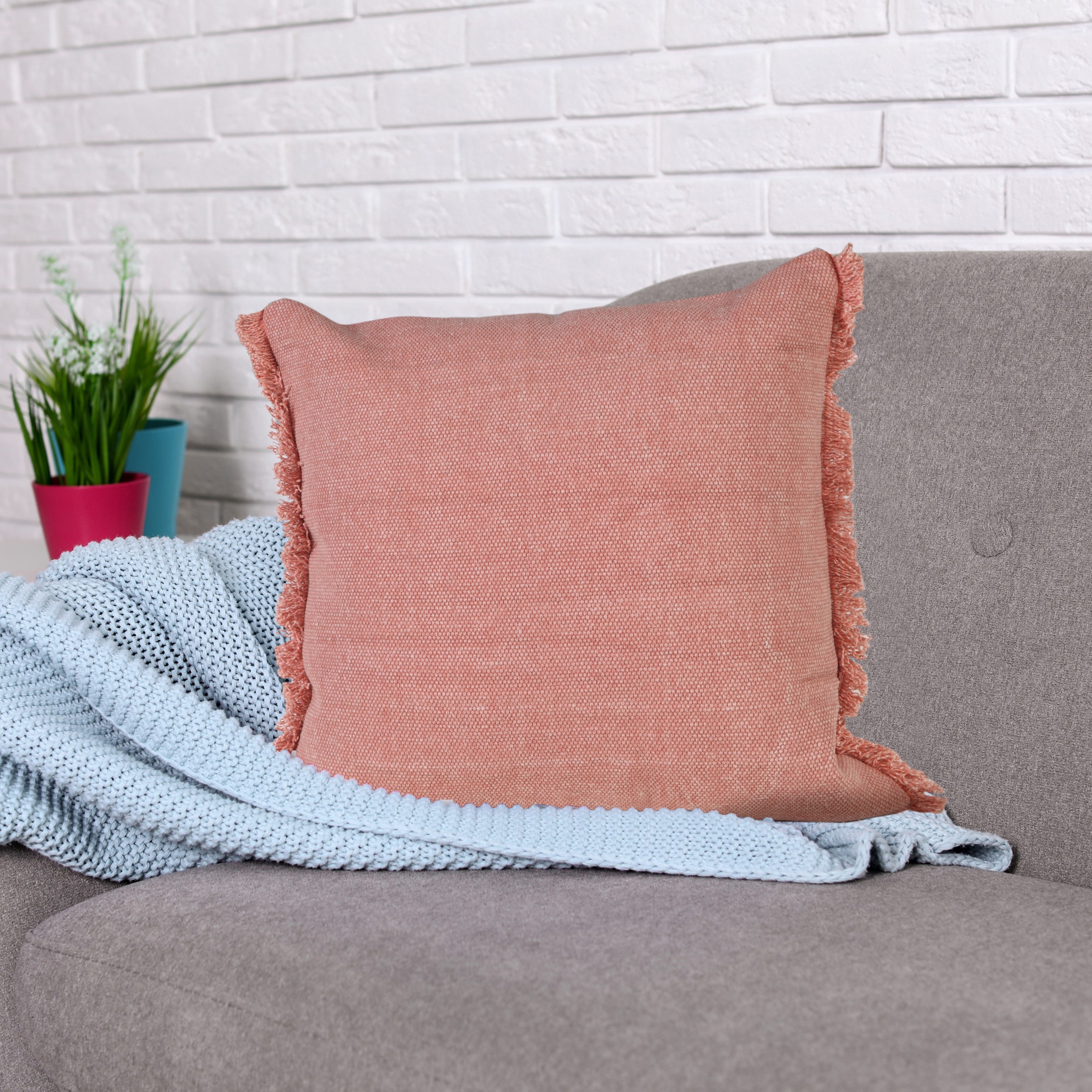 https://ak1.ostkcdn.com/images/products/is/images/direct/adc351a96c3ce0af2f12a725897b999234a3de72/Light-Pink-Solid-Stonewash-Throw-Pillow-with-Fringe.jpg