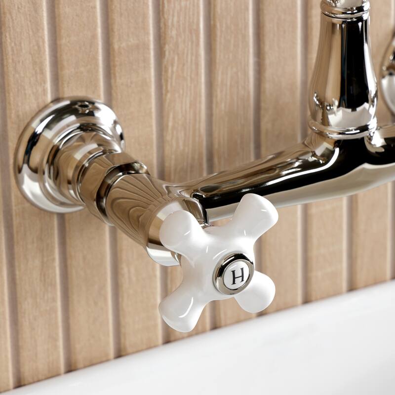 Kingston Brass English Country Two-Handle 2-Hole Wall Mount Bathroom Faucet