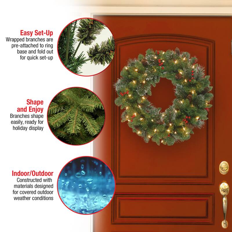 National Tree Company 24 in. Crestwood Spruce Wreath with Silver Bristle, Cones, Red Berries and Glitter with 50 Clear Lights