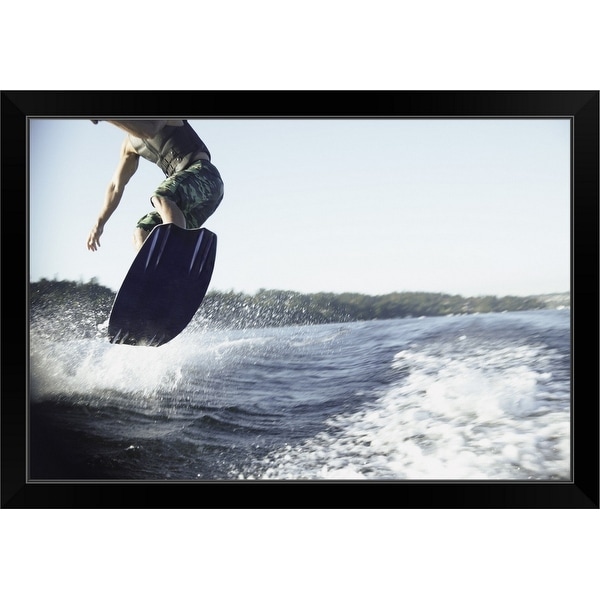"Man wake boarding" Black Framed Print