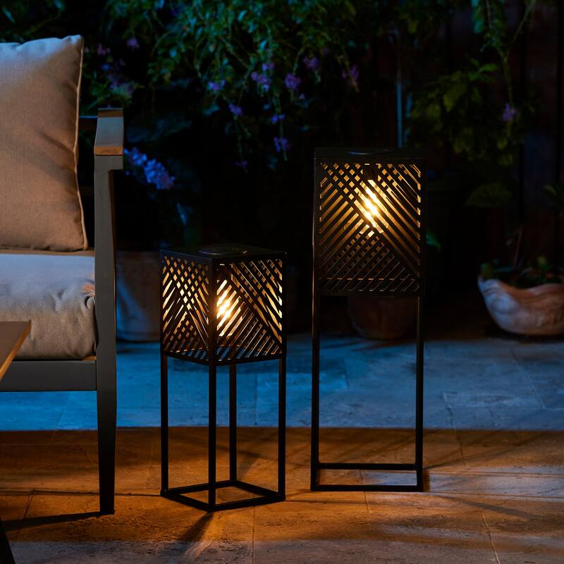 Glitzhome Set of 2 Black Metal Cutout Pattern Solar Powered Edison Bulb Outdoor Floor Lantern or Planter Stands - Black - 23.75"H & 17.75"H